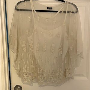 Flowy white blouse with floral details